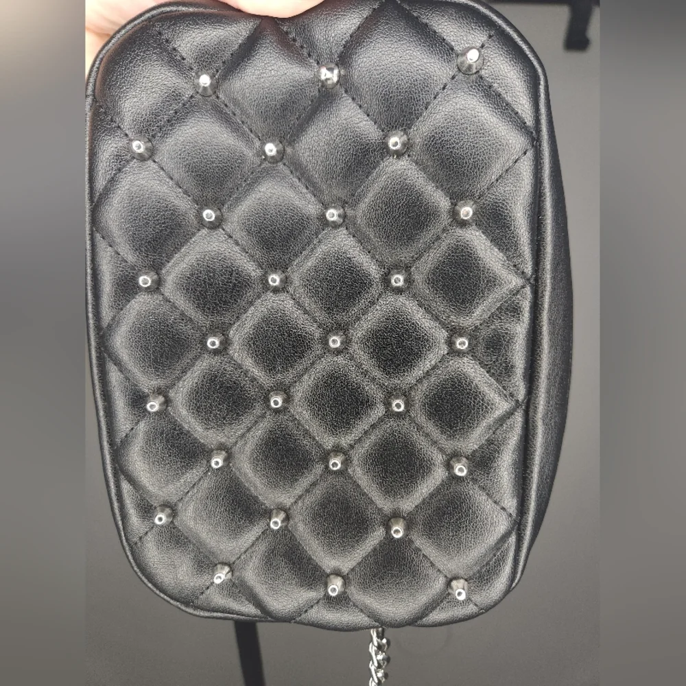 Rebecca Minkoff• Mini quilted studded black crossbody bag. 7.25” x 2.25” x 5.25”